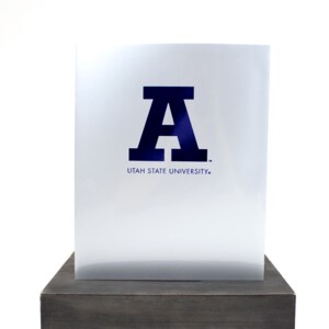 silver block a on navy folder